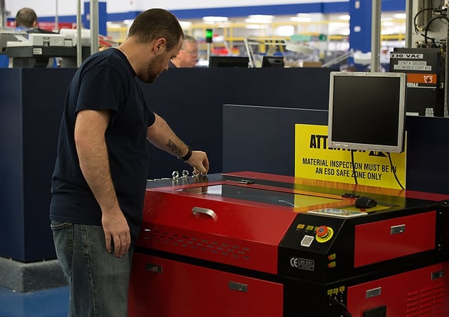 Operator working on KH7050 Laser Engraving Machine