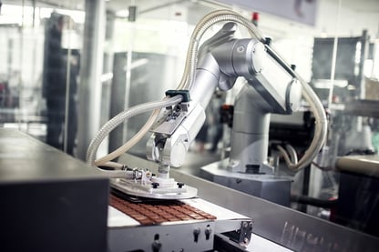 Robot making chocolate in a factory web