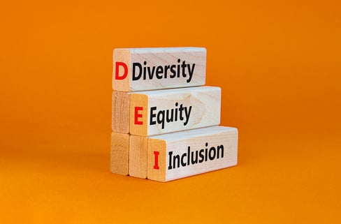 diversity-equity-inclusion-on-blocks-orange-background
