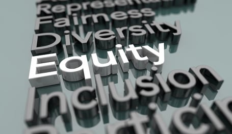 diversity-equity-inclusion-raised-letters-gray-background