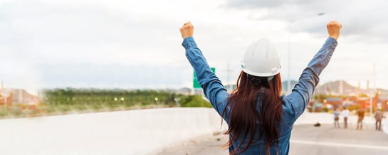 female-hardhat-back-arms-raised