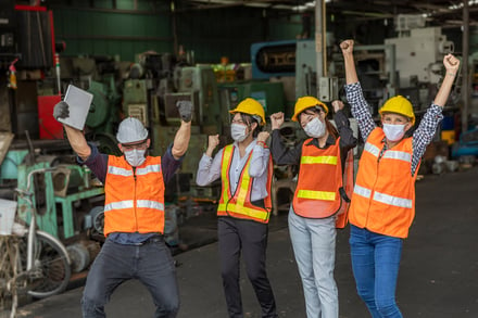 happy-industrial-plant-workers-cheering