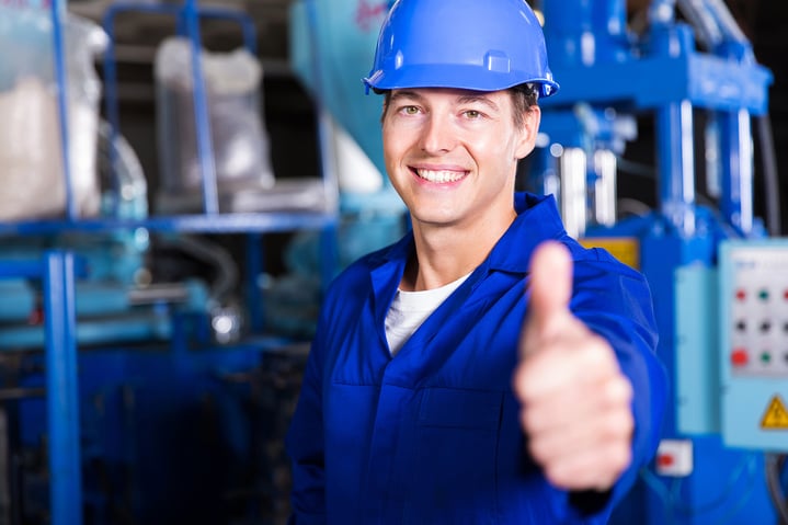 happy-male-factory-worker-in-blue-thumbs-up