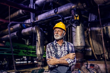 older-male-factory-worker-looking-stressed