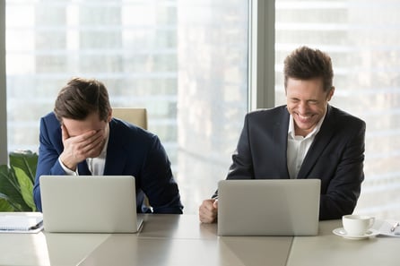 professional-males-laughing-with-laptops