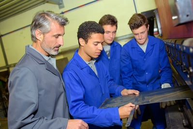 teacher_students_learning_manufacturing_tradeschool