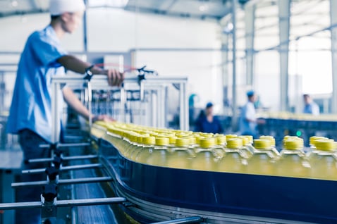 worker-on-bottling-line