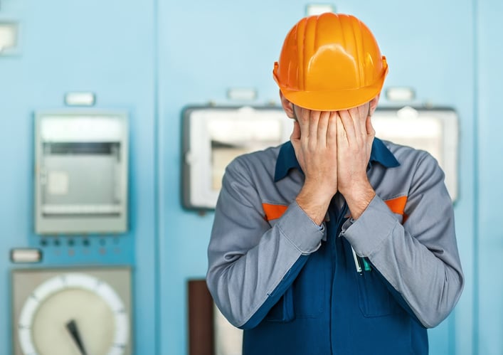 worker-orange-hard-hat-hands-on-face-upset