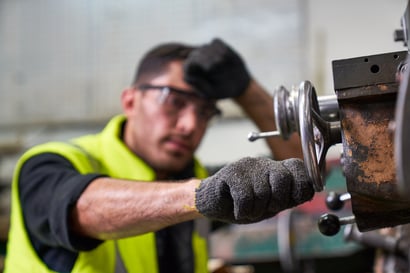 worker-working-on-old-industrial-equipment